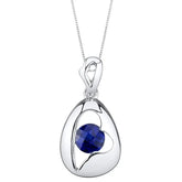Silver pendant with a blue sapphire gemstone on a white background